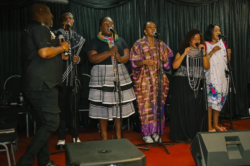The worship team singing on stage